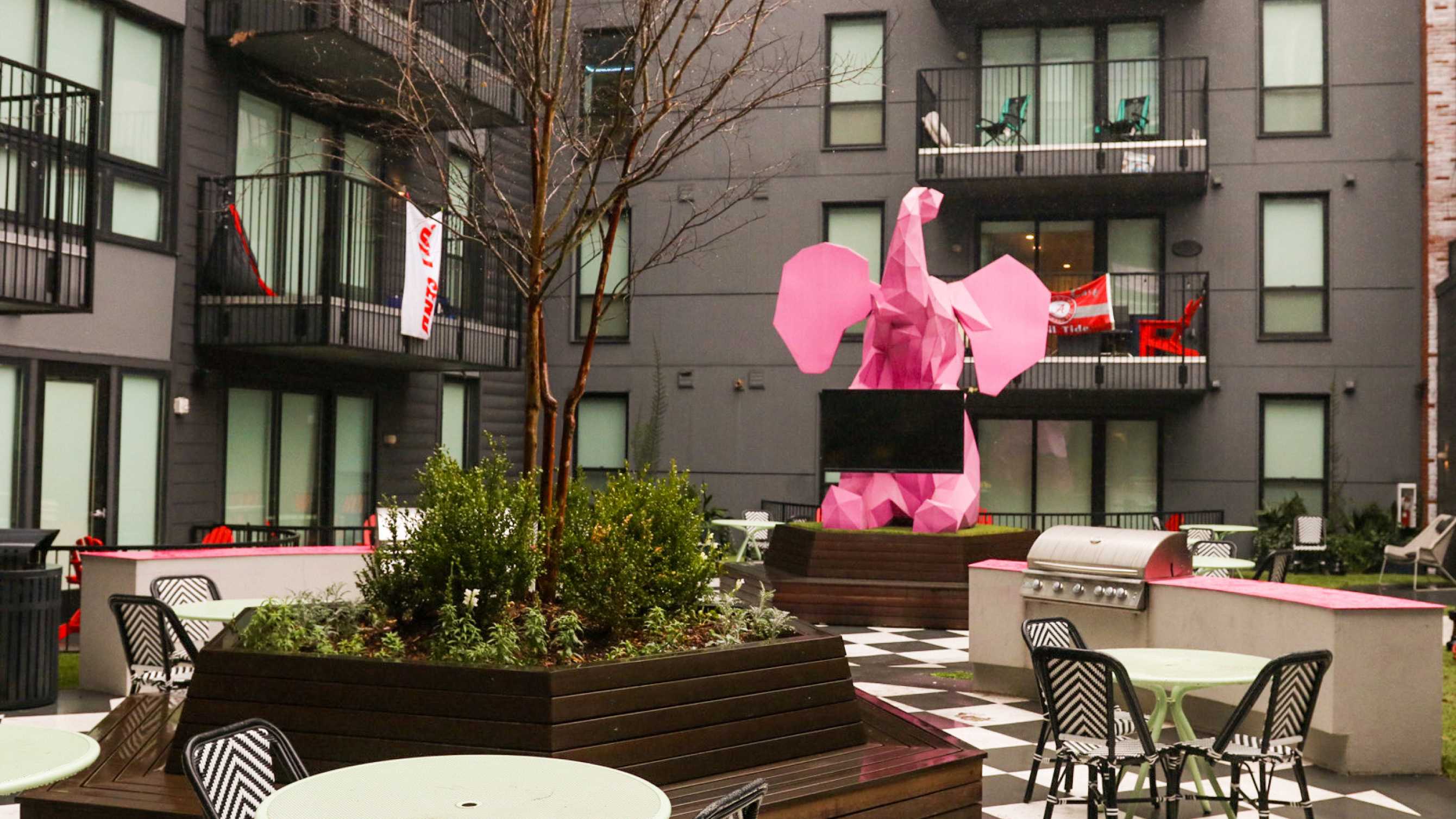 A pink elephant statue outside