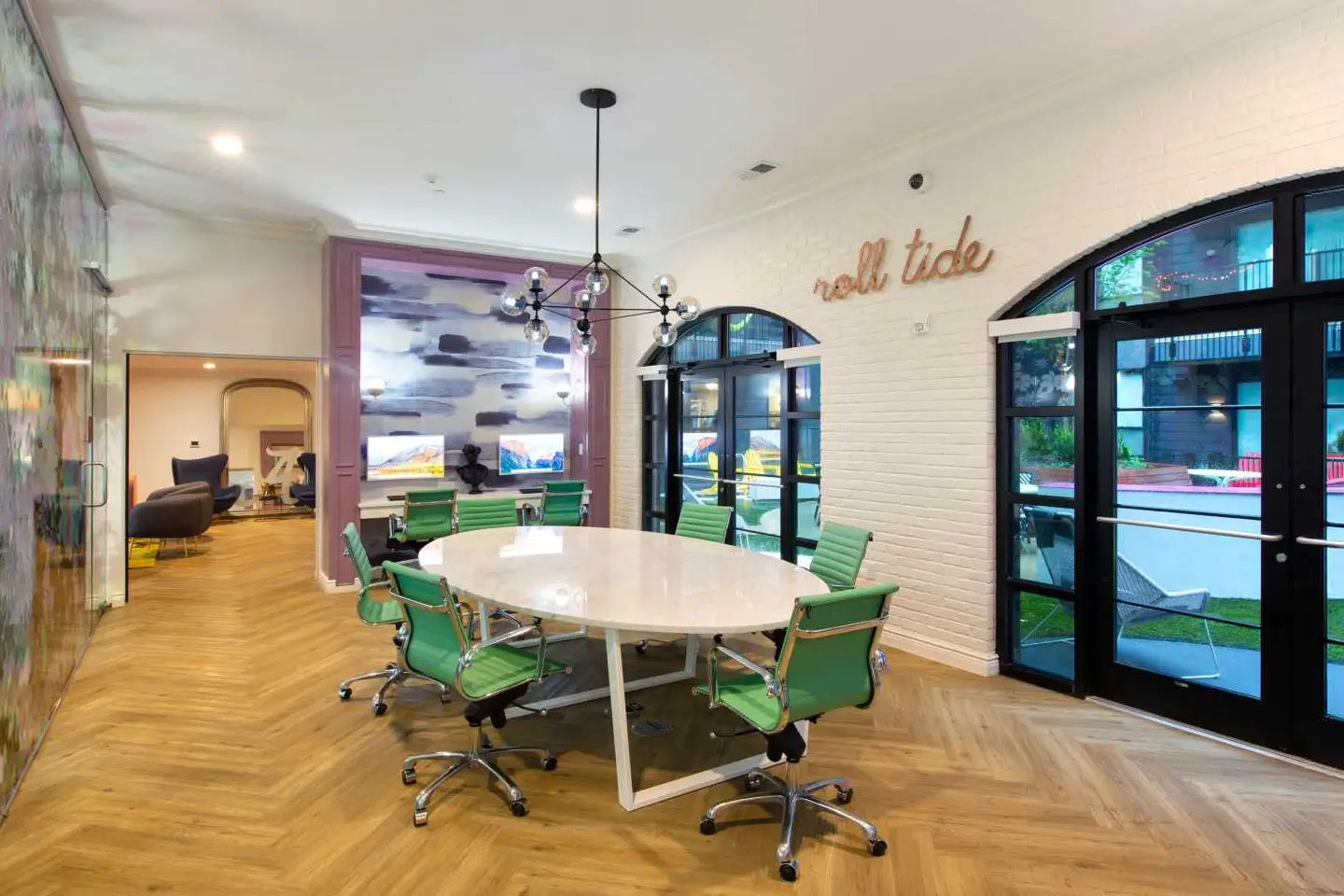 Round table and chairs inside the Hib Tuscaloosa study spaces