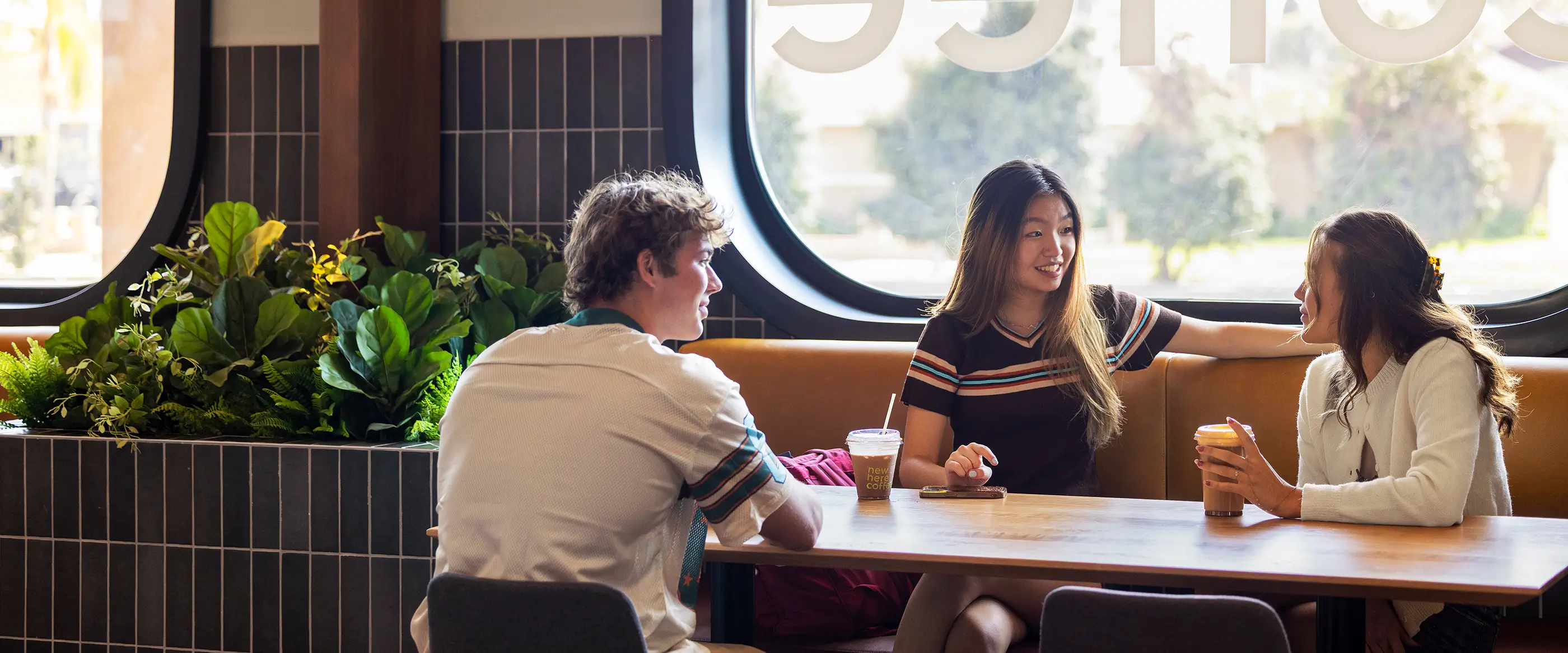group of young adults in a coffee shop