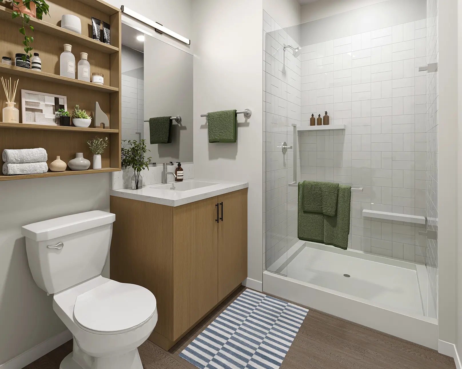 Toilet, shower, and sink with cabinets.
