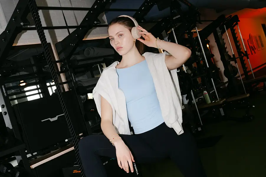 A young woman wearing headphones