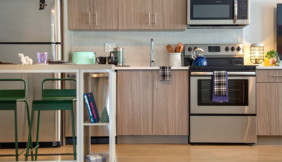 Upscale Stainless-Steel Appliances Including Stove, Oven, Microwave, Dishwasher, and Refrigerator