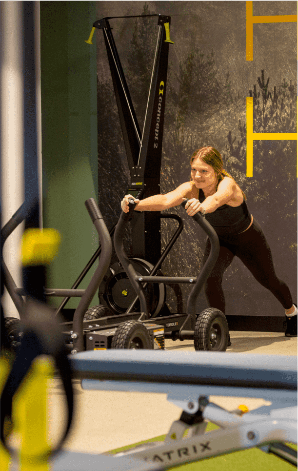 Woman using exercise equipment in a gym