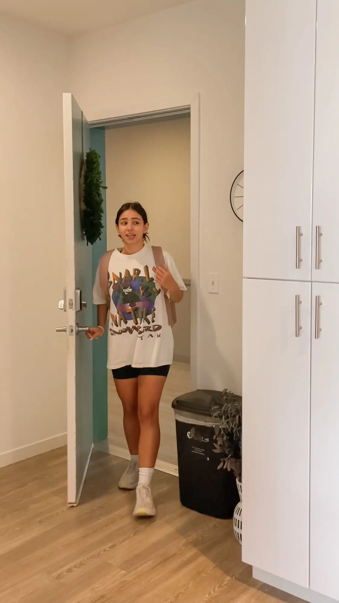 Person walking into an apartment